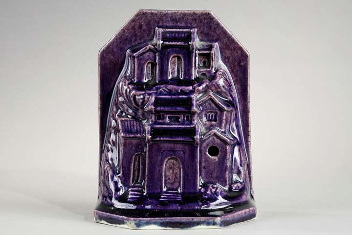 Sculpture porcelain aubergine color probably paperweight in form of houses and rocks